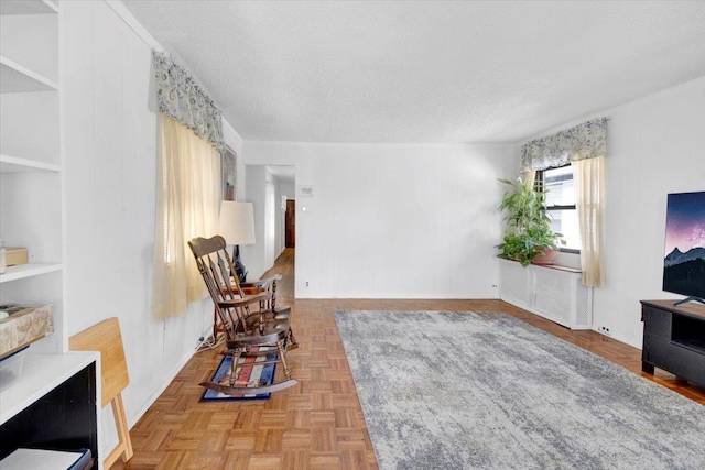 611 Clarence Ave, Bronx, NY 10465 - living area featuring a textured ceiling