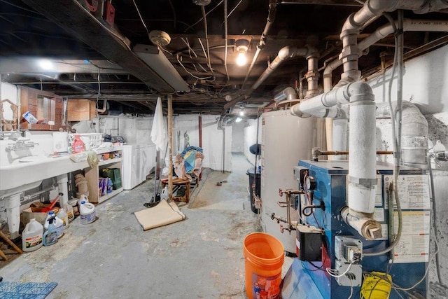 611 Clarence Ave, Bronx, NY 10465 - unfinished basement with washer / clothes dryer and a heating unit