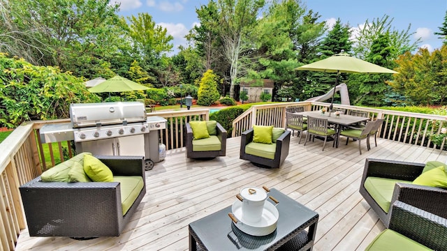 1260 Water Ter, Southold, NY 11971 - deck featuring outdoor dining space, an outdoor living space, view of scattered trees, and grilling area