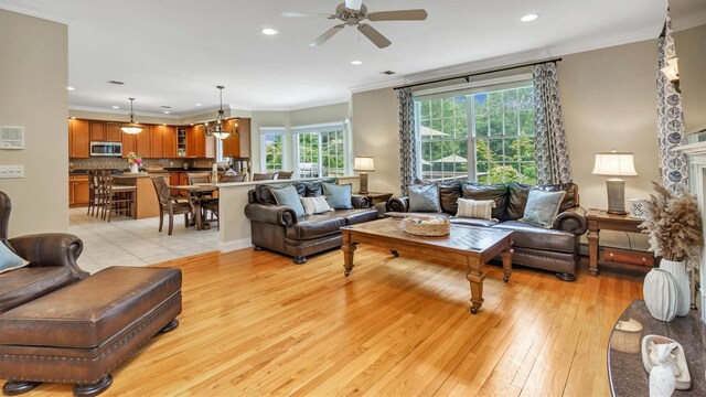 1260 Water Ter, Southold, NY 11971 - living room with a ceiling fan, ornamental molding, light wood finished floors, and recessed lighting