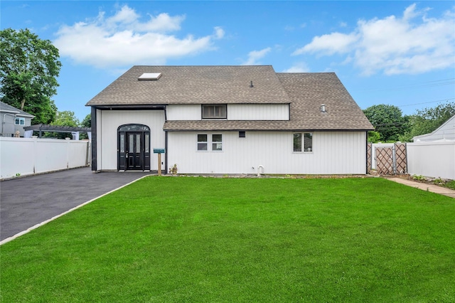 205 Blueberry Ln, Hicksville, NY 11801 - rear view of property featuring roof with shingles