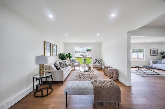 205 Blueberry Ln, Hicksville, NY 11801 - living room with plenty of natural light, recessed lighting, wood finished floors, and baseboards