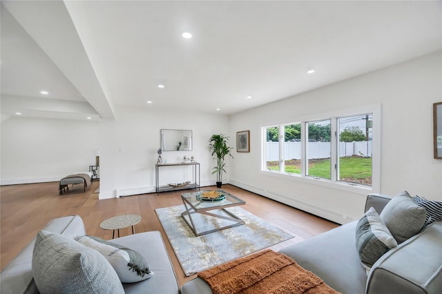205 Blueberry Ln, Hicksville, NY 11801 - living area with wood finished floors, recessed lighting, baseboards, and baseboard heating
