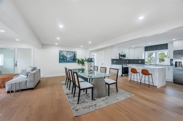 205 Blueberry Ln, Hicksville, NY 11801 - dining space with light wood-type flooring, recessed lighting, and baseboards
