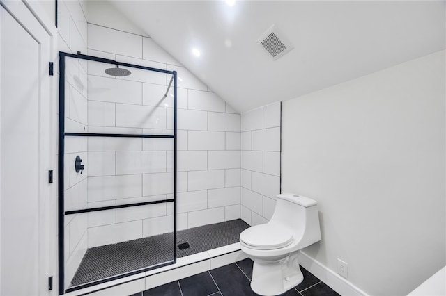 205 Blueberry Ln, Hicksville, NY 11801 - bathroom with vaulted ceiling, tiled shower, toilet, tile patterned floors, and baseboards