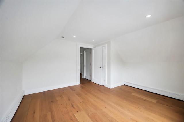 205 Blueberry Ln, Hicksville, NY 11801 - additional living space featuring a baseboard heating unit, vaulted ceiling, light wood-type flooring, recessed lighting, and baseboards