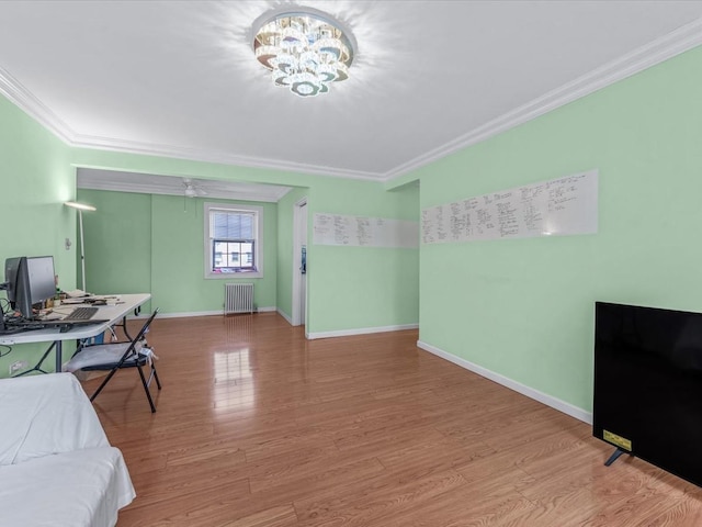 147-11 79th Ave Unit 1N, Flushing, NY 11367 - office space with crown molding, a chandelier, radiator heating unit, wood finished floors, and baseboards