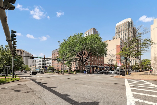 10 N Broadway Unit 3H, White Plains, NY 10601 - view of asphalt street featuring traffic lights, sidewalks, curbs, traffic signs, and street lighting