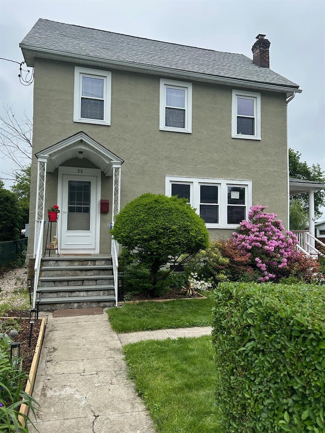 80 Woodland St, Mount Kisco, NY 10549 - view of front facade featuring a chimney, stucco siding, and entry steps