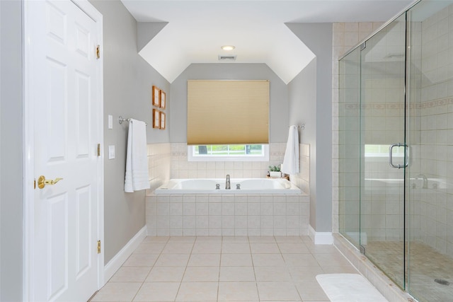 66 Carol Ln, Poughquag, NY 12570 - bathroom featuring a garden tub, a stall shower, tile patterned floors, baseboards, and lofted ceiling