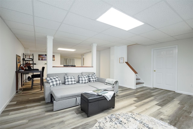 66 Carol Ln, Poughquag, NY 12570 - living area featuring light wood-style floors, a drop ceiling, stairway, and baseboards