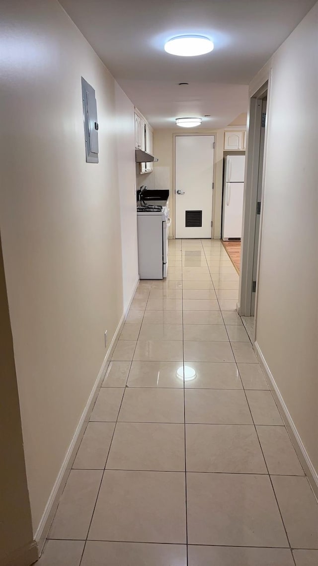 43-17 Union St Unit 6G, Flushing, NY 11355 - corridor with light tile patterned floors, baseboards, and electric panel