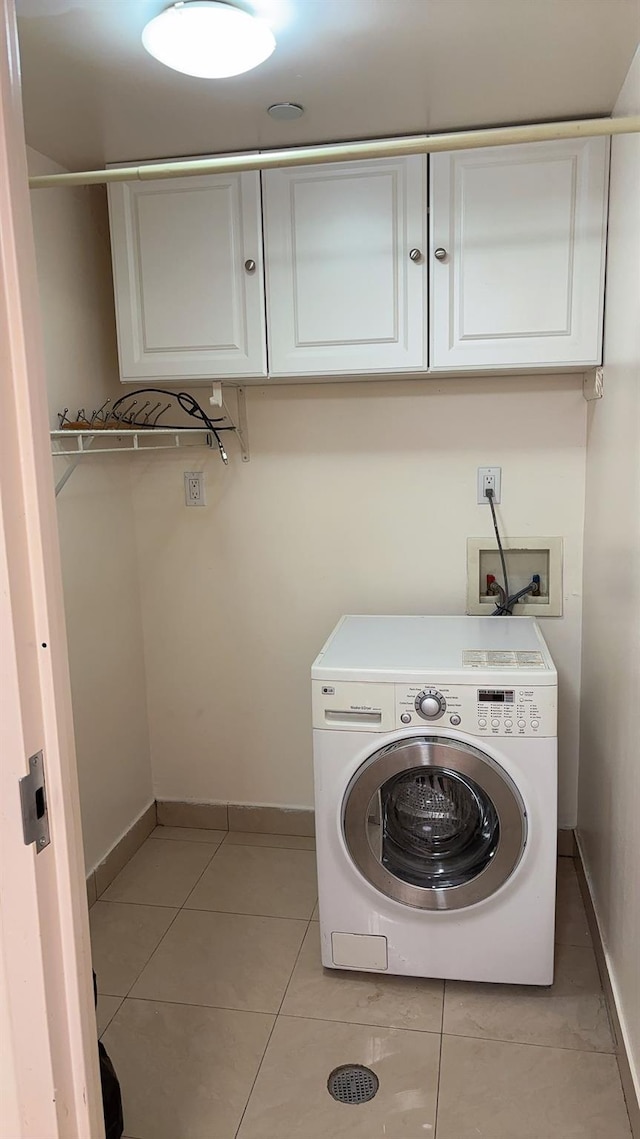 43-17 Union St Unit 6G, Flushing, NY 11355 - laundry area with washer / dryer, cabinet space, baseboards, and light tile patterned flooring
