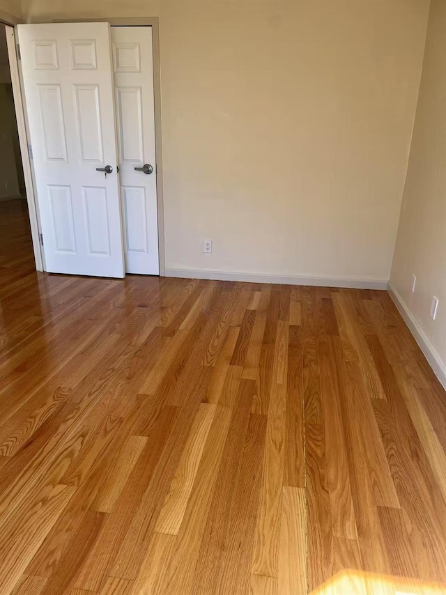 43-17 Union St Unit 6G, Flushing, NY 11355 - unfurnished room featuring baseboards and wood finished floors