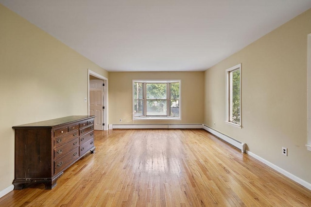 12 Gillis Ave, Nyack, NY 10960 - empty room featuring light wood-type flooring, healthy amount of natural light, and baseboard heating