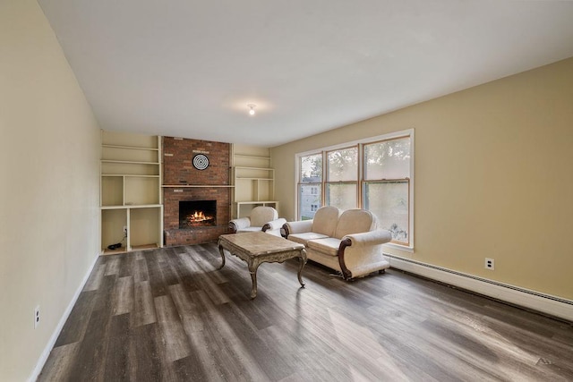 12 Gillis Ave, Nyack, NY 10960 - living area featuring built in features, dark wood-type flooring, a fireplace, and a baseboard heating unit