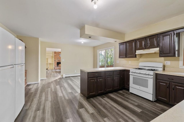 12 Gillis Ave, Nyack, NY 10960 - kitchen with white gas range, under cabinet range hood, baseboard heating, light countertops, and dark wood-style flooring