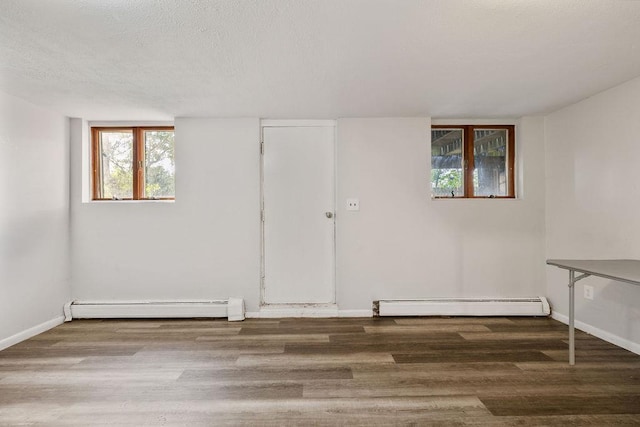 12 Gillis Ave, Nyack, NY 10960 - empty room with a baseboard radiator, wood finished floors, and a textured ceiling