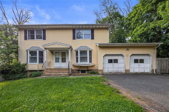 12 Gillis Ave, Nyack, NY 10960 - traditional home with an attached garage, asphalt driveway, and entry steps