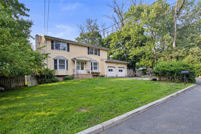 12 Gillis Ave, Nyack, NY 10960 - view of front of home with a garage and a chimney