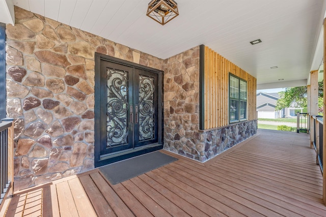 8 Hamilton Pl, Lake Grove, NY 11755 - entrance to property featuring stone siding and a porch