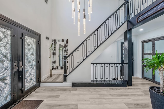8 Hamilton Pl, Lake Grove, NY 11755 - foyer with a towering ceiling, wood finished floors, baseboards, and stairway