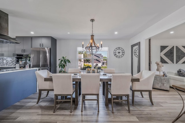8 Hamilton Pl, Lake Grove, NY 11755 - dining room featuring a chandelier, recessed lighting, and light wood-type flooring