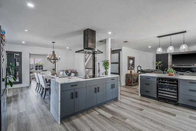 8 Hamilton Pl, Lake Grove, NY 11755 - kitchen featuring wine cooler, gray cabinets, island exhaust hood, light wood finished floors, and recessed lighting