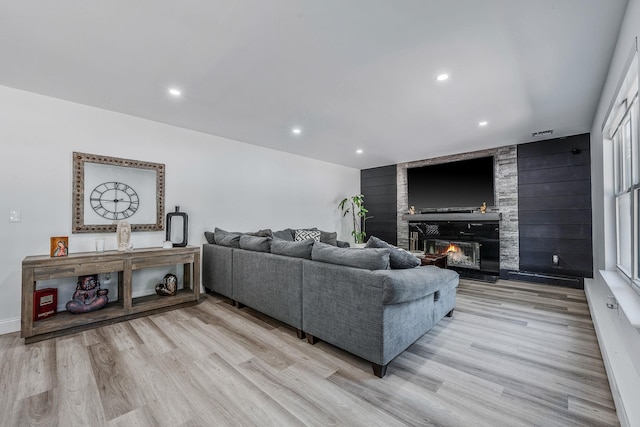 8 Hamilton Pl, Lake Grove, NY 11755 - living area with light wood finished floors, a fireplace, and recessed lighting
