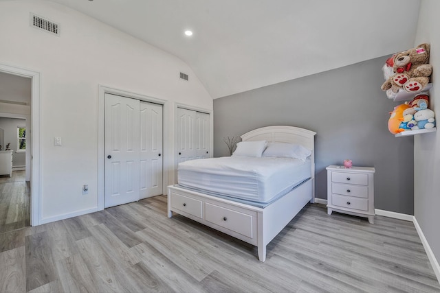 8 Hamilton Pl, Lake Grove, NY 11755 - bedroom with vaulted ceiling, two closets, light wood-type flooring, recessed lighting, and baseboards
