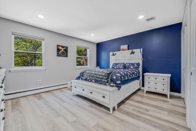 8 Hamilton Pl, Lake Grove, NY 11755 - bedroom with a baseboard heating unit, light wood-type flooring, recessed lighting, and baseboards