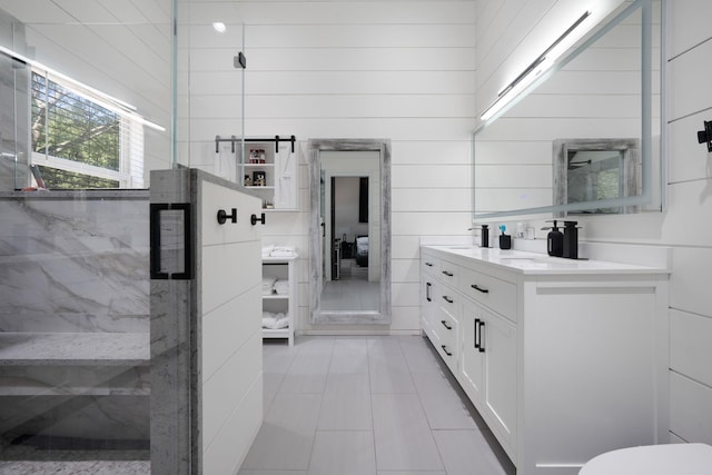 8 Hamilton Pl, Lake Grove, NY 11755 - full bathroom with double vanity, tile patterned floors, a shower stall, and toilet