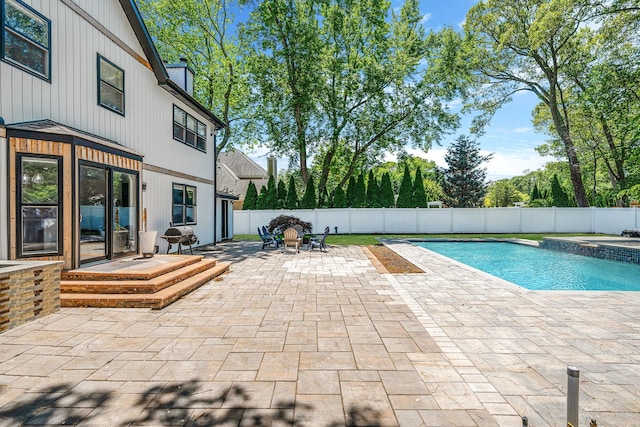 8 Hamilton Pl, Lake Grove, NY 11755 - view of pool featuring a patio, a fenced backyard, a pool with connected hot tub, and outdoor dining area