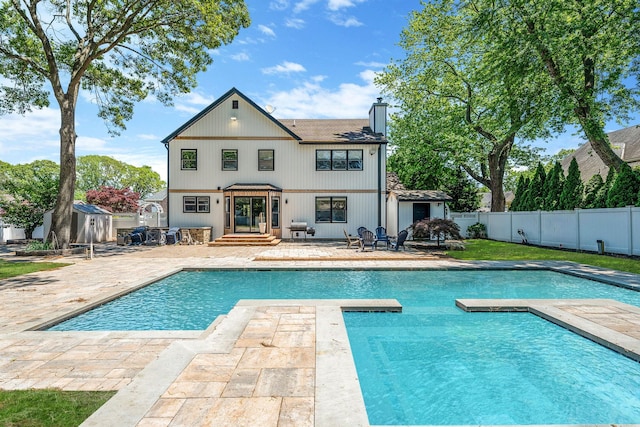 8 Hamilton Pl, Lake Grove, NY 11755 - back of property featuring a patio area, a fenced backyard, and a chimney