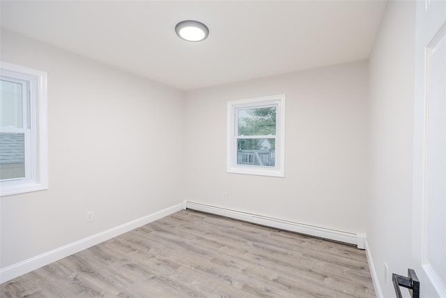 59 Burney Blvd, Mastic, NY 11950 - empty room featuring a baseboard radiator, wood finished floors, and baseboards