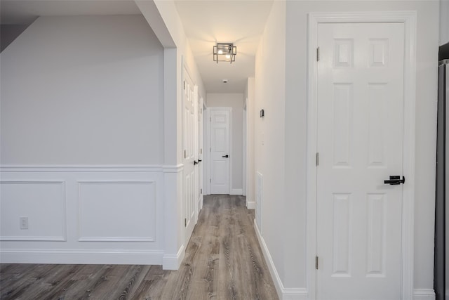59 Burney Blvd, Mastic, NY 11950 - corridor featuring wood finished floors and baseboards