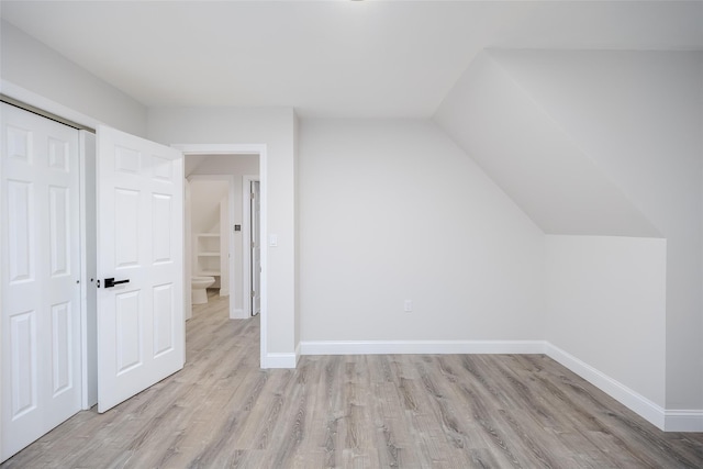 59 Burney Blvd, Mastic, NY 11950 - bonus room featuring light wood-style flooring, baseboards, and vaulted ceiling