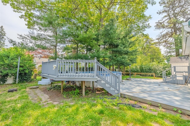 59 Burney Blvd, Mastic, NY 11950 - wooden deck with stairway and view of scattered trees