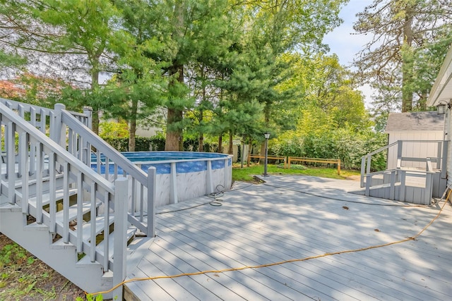 59 Burney Blvd, Mastic, NY 11950 - wooden terrace featuring an outdoor pool and stairway