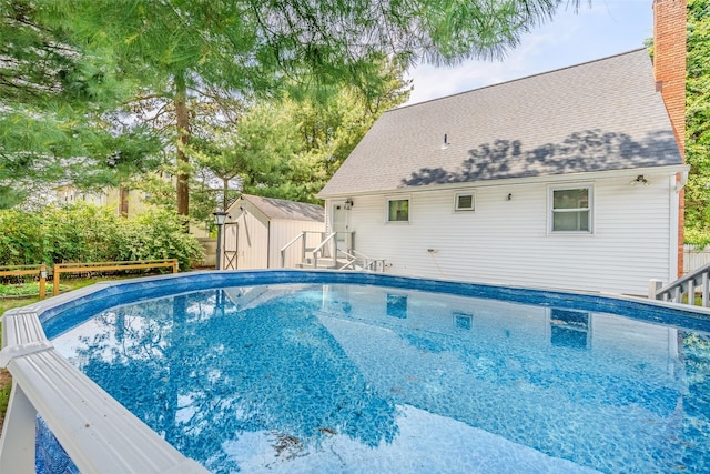59 Burney Blvd, Mastic, NY 11950 - swimming pool featuring a storage shed