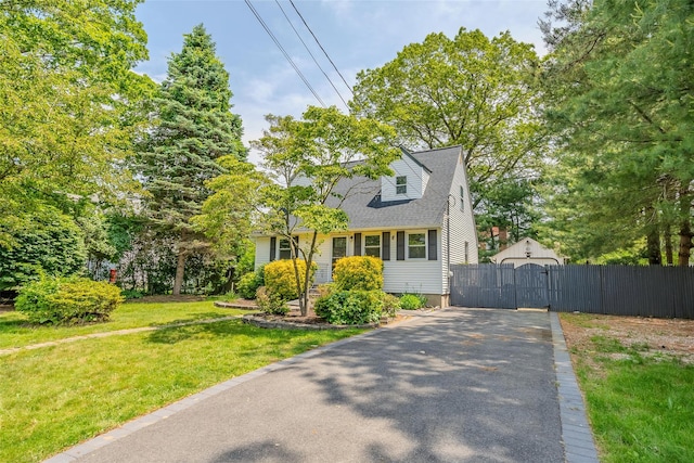 59 Burney Blvd, Mastic, NY 11950 - cape cod-style house with a gate and asphalt driveway