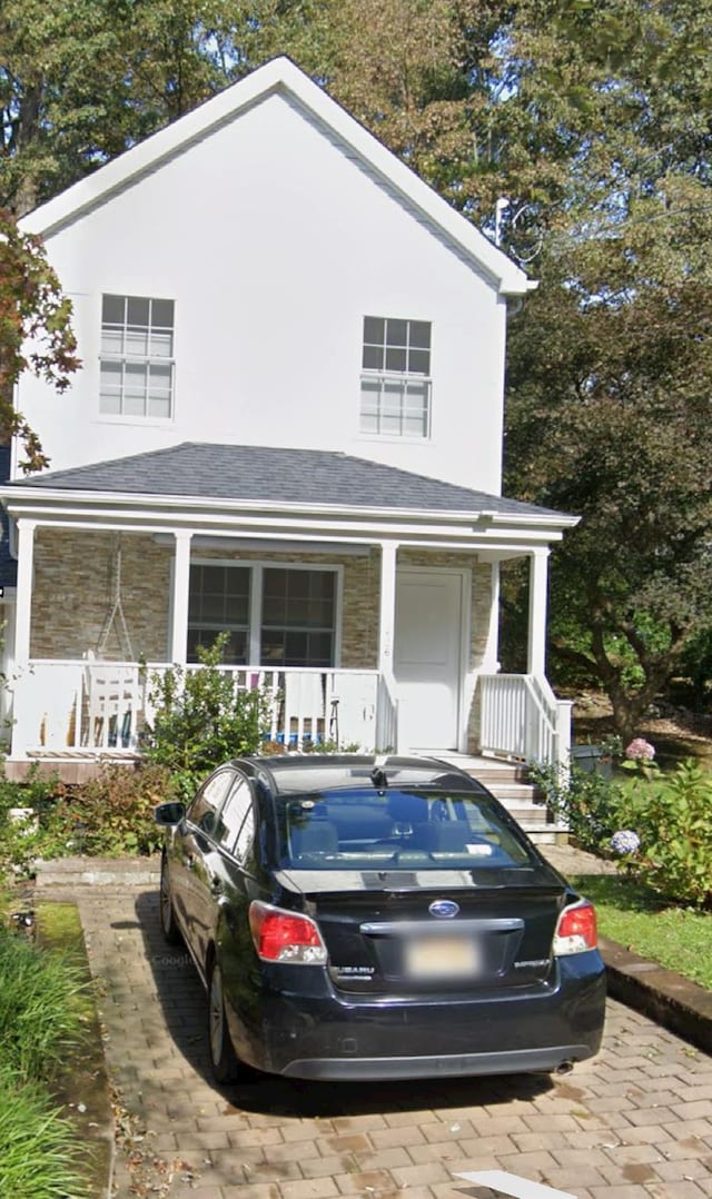 1626 Mogul Dr Unit 1626, Mohegan Lake, NY 10547 - view of front of house featuring a porch and stone siding