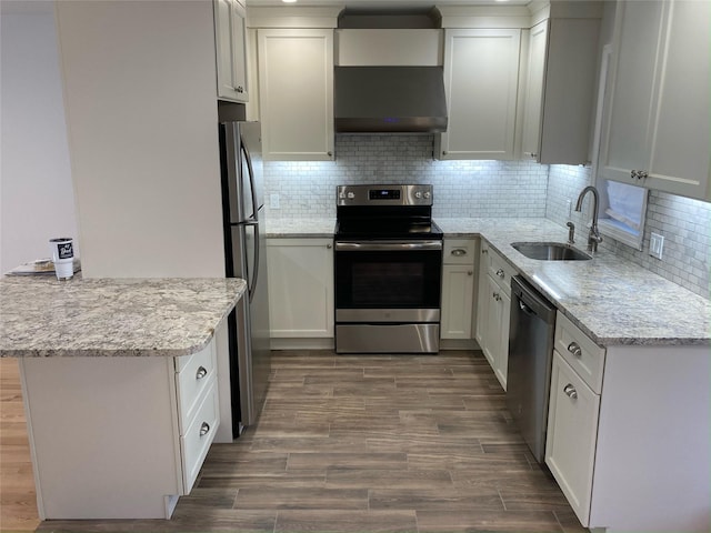 1626 Mogul Dr Unit 1626, Mohegan Lake, NY 10547 - kitchen with appliances with stainless steel finishes, a sink, under cabinet range hood, white cabinets, and tasteful backsplash