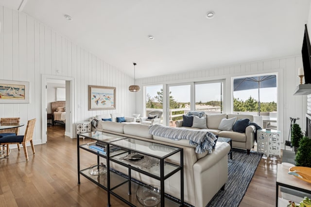 355 Dune Rd, Westhampton Beach, NY 11978 - living room featuring lofted ceiling, wood finished floors, and wood walls