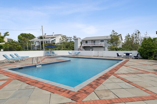 355 Dune Rd, Westhampton Beach, NY 11978 - view of swimming pool featuring a patio