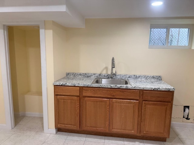 110 Terrace Ave, Elmont, NY 11003 - bar with a sink, light tile patterned floors, and baseboards