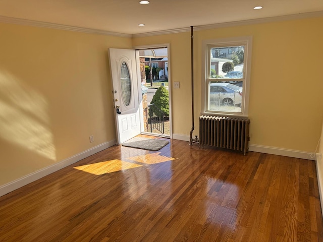 110 Terrace Ave, Elmont, NY 11003 - entryway featuring radiator, crown molding, baseboards, wood finished floors, and recessed lighting