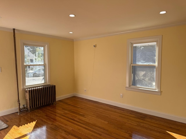 110 Terrace Ave, Elmont, NY 11003 - spare room with radiator, baseboards, crown molding, wood finished floors, and recessed lighting