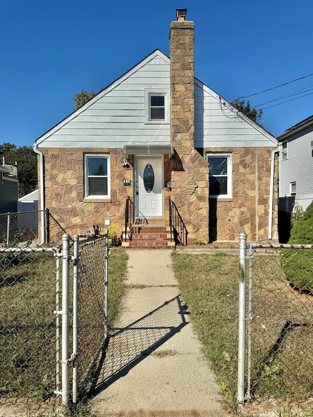 110 Terrace Ave, Elmont, NY 11003 - view of front facade with stone siding, entry steps, a chimney, and a gate