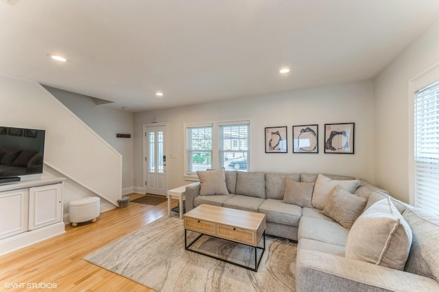 32 Henderson Ave, Port Washington, NY 11050 - living room with stairs, light wood finished floors, recessed lighting, and baseboards